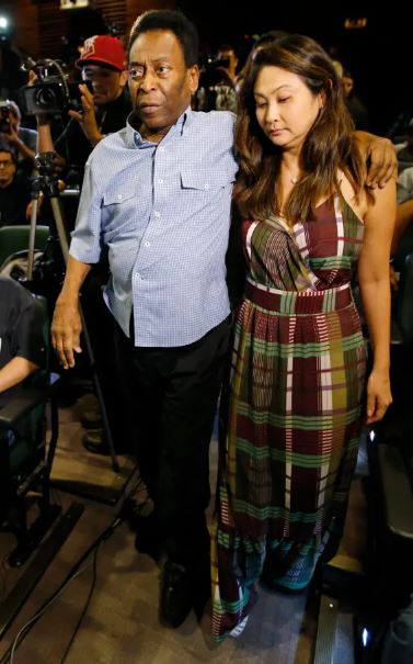 An old photo of Marcia with Pele