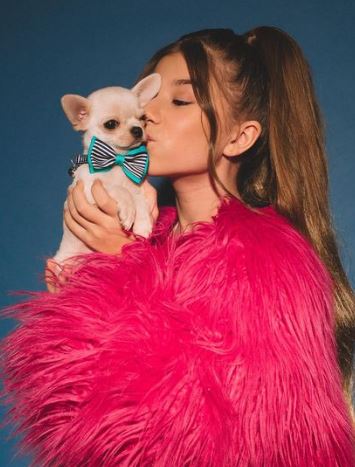 Milana with her pet dog