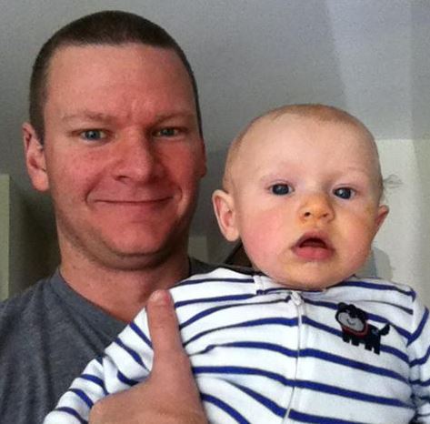 An old photo of Denny with his child