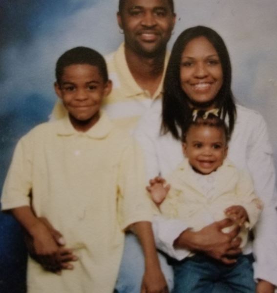 An old photo of Tee with his wife and kids