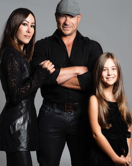 Angie Katsanevas with her husband and daughter