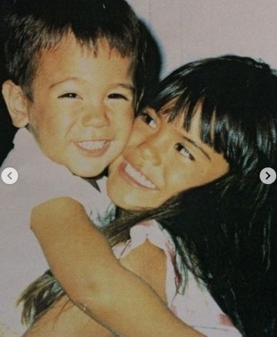 Childhood photo of Jesiree with her brother