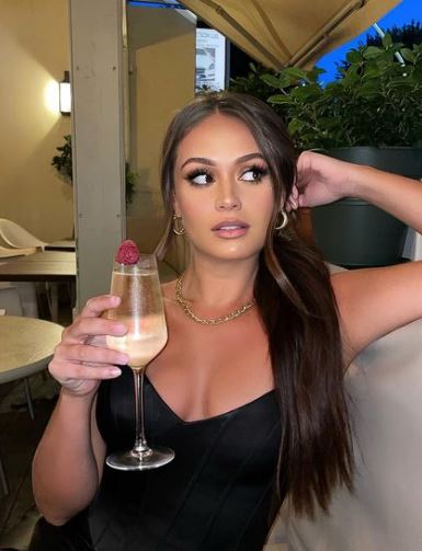 Olivia Hawkins consumes alcohol