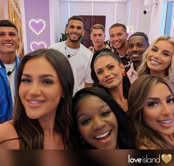 Olivia Hawkins with contestants of Love Island