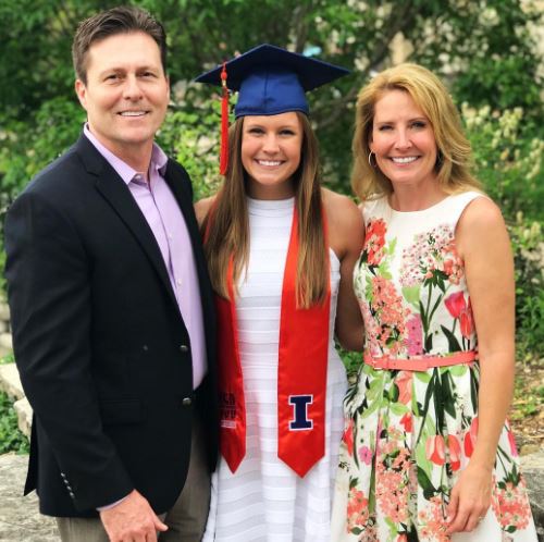 Christina with her parents on graduation day