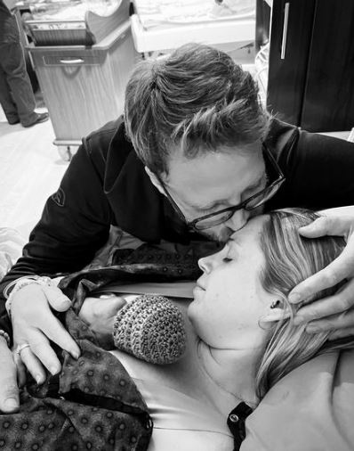 Dylan Brown with his fiancée Sarah Herron and son Oliver Brown