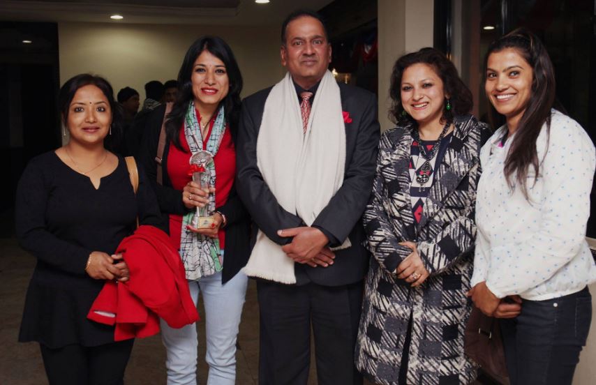 Kailash Sirohiya with the employees of KMG