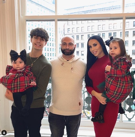 Rachel Fuda with her kids and husband
