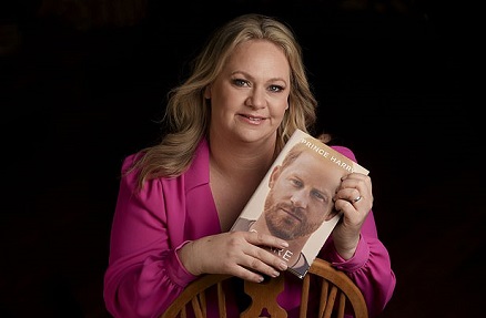Sasha Walpole holding Prince Harry book