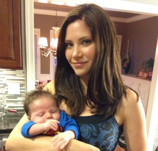 An old photo of Courtney with her child