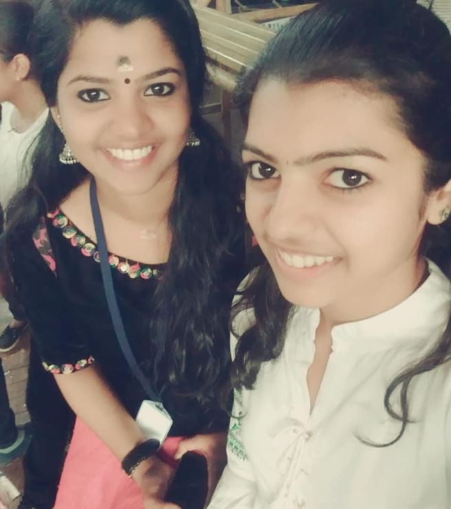 Young Athulya with her friend