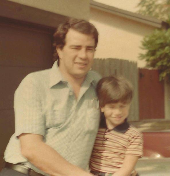 Childhood photo of Bryan with his dad