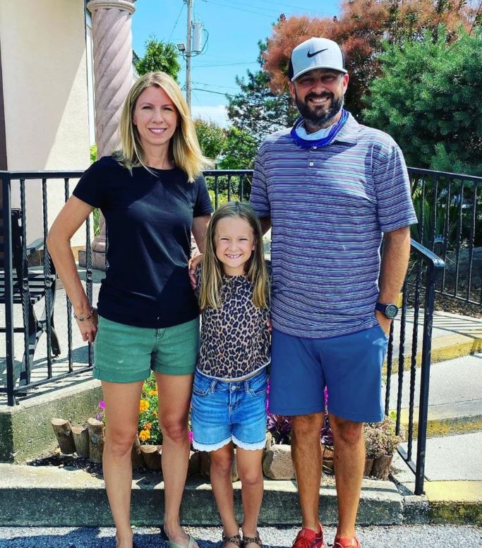 Laura Baines with her husband and daughter