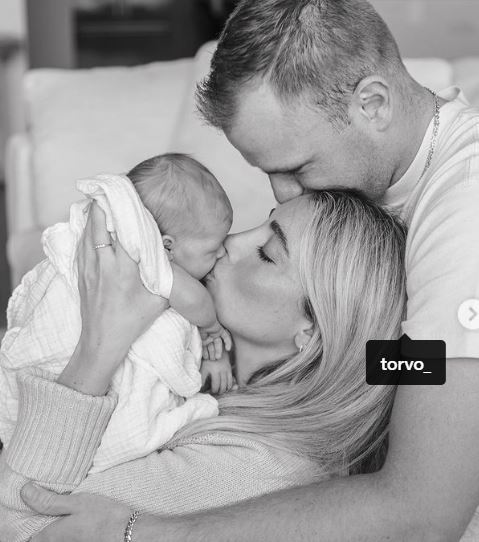 Lauren Elizabeth with her husband and daughter