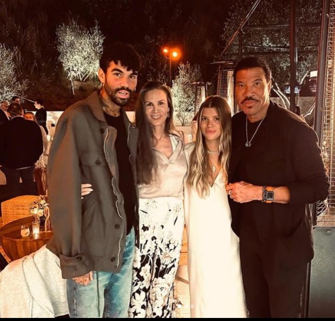Miles Richie with family members