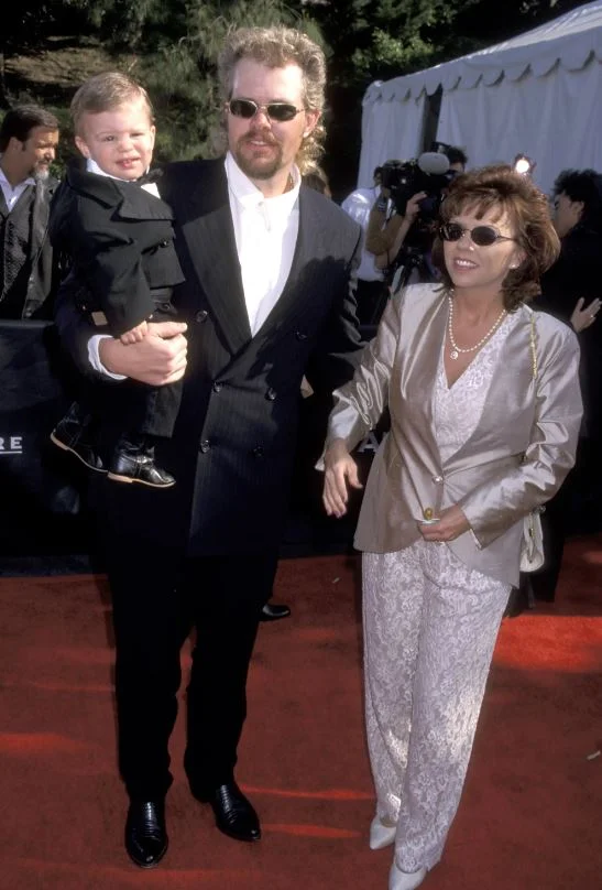 An old photo of Tricia Lucus with her husband and son