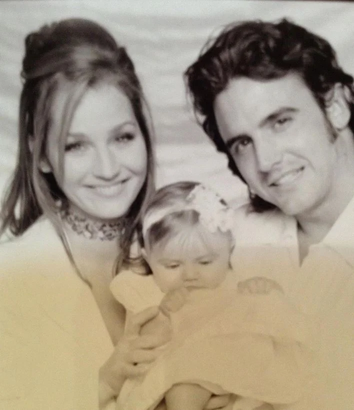Childhood photo of Emmy with her parents