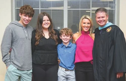 Chris Stewart (Announcer) with his wife and kids