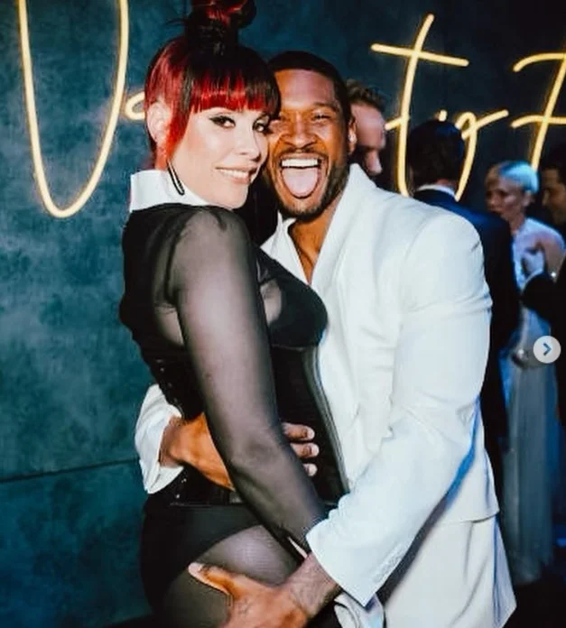 Usher with his wife