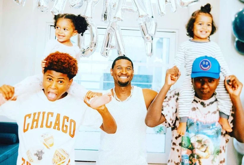 Usher with his wife kids
