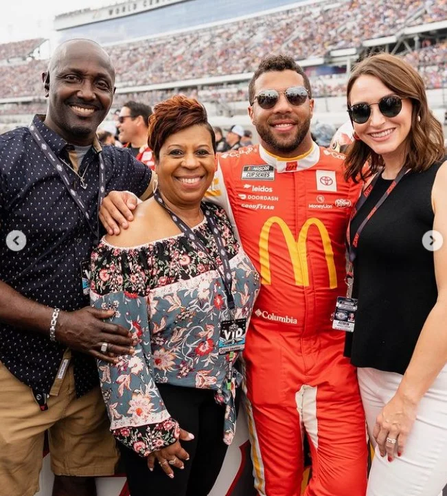 Bubba Wallace with his parents and wife Amanda