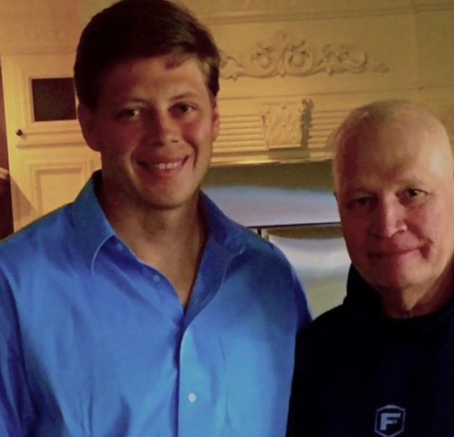 Chris Mortensen with his son